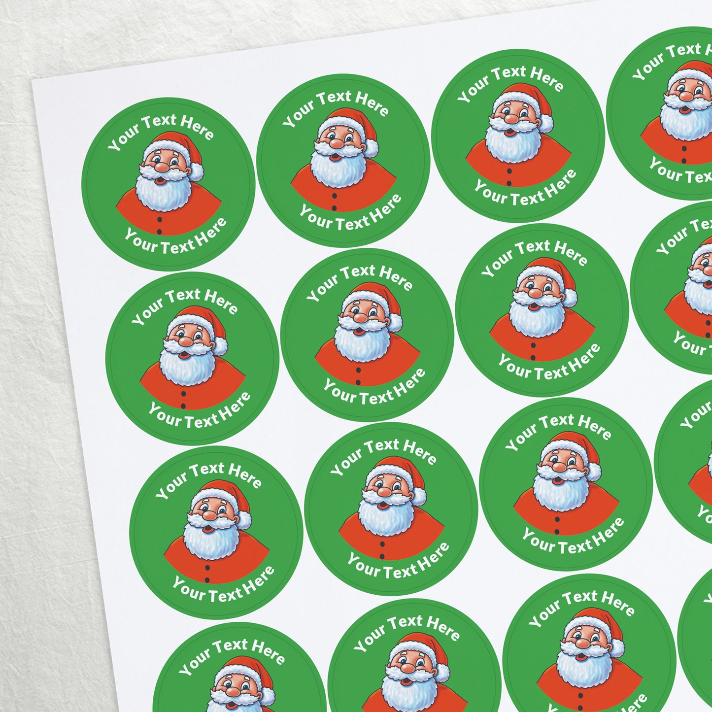 A sheet of green stickers featuring Father Christmas in the centre. Placeholder text 'Your text here' is above and below the image for customisation.