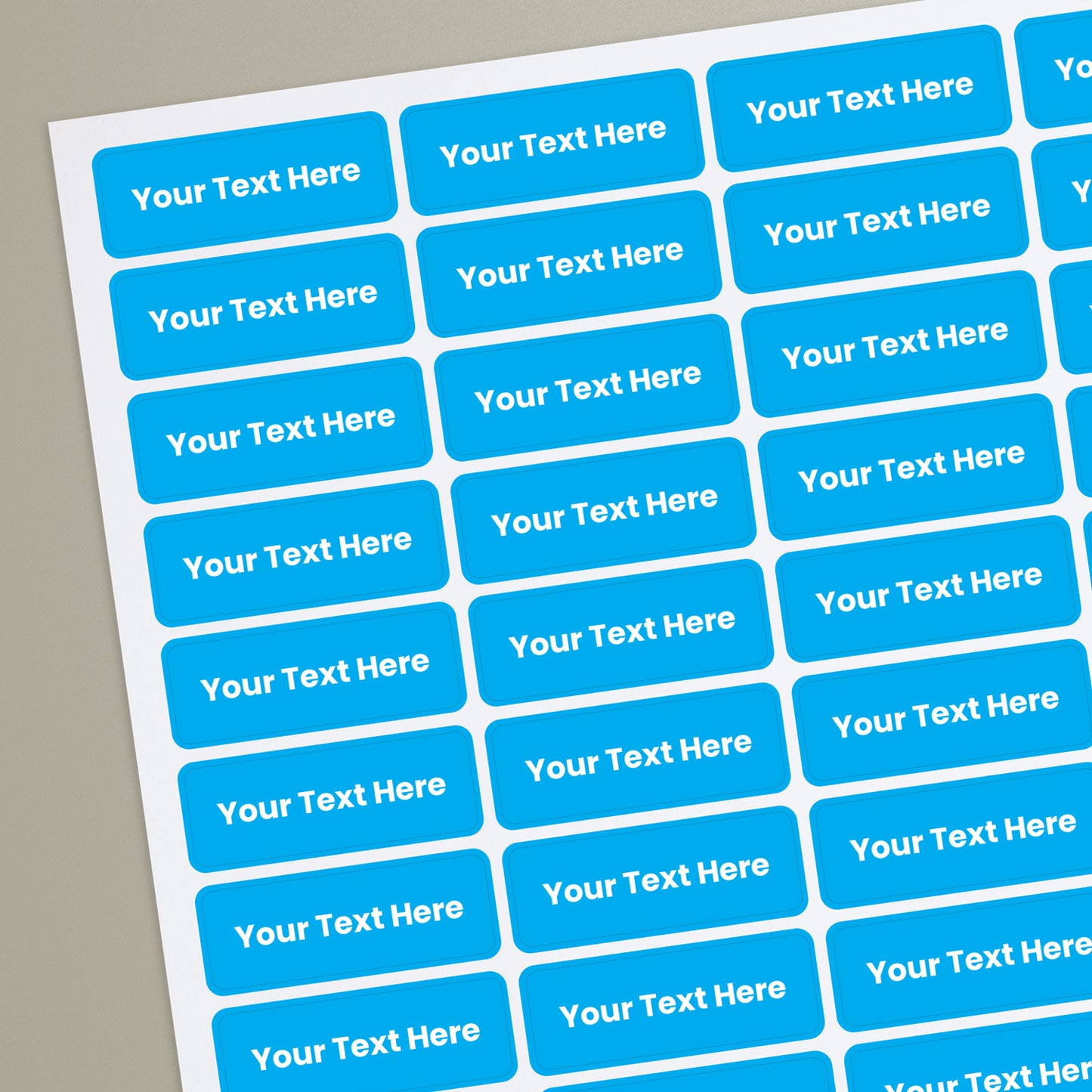 Sheet of rectangular blue stickers with white placeholder text reading 'Your Text Here'.