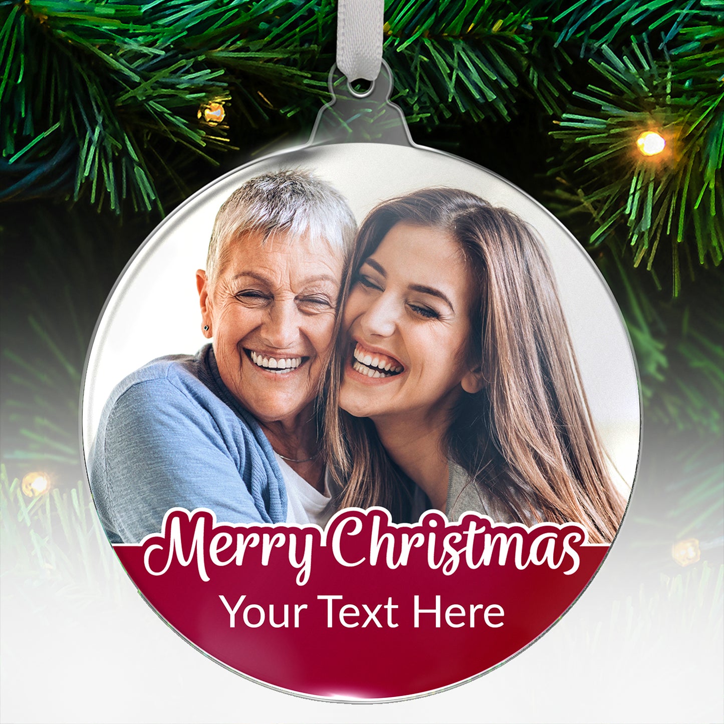 A personalised acrylic Christmas bauble with 'Merry Christmas' text and photo of mother and daughter surrounded by greenery and Christmas lights.