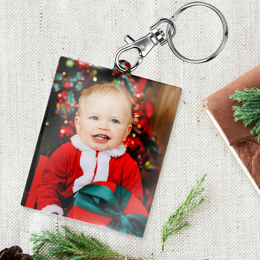 Personalised Keyring with a photo of a child in a Santa outfit.