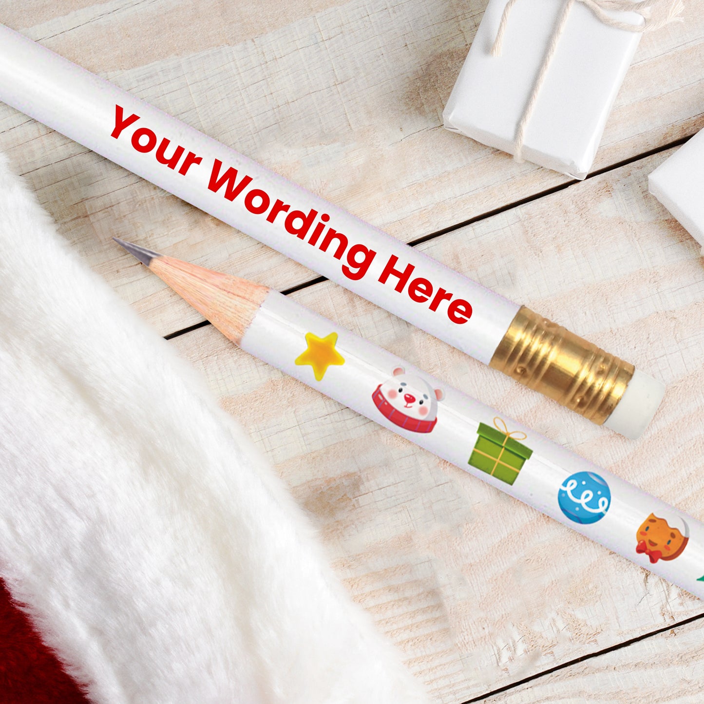 A white HB pencil with a Christmas theme, featuring decorations such as a reindeer, presents and polar bear, and text space for a personalised message.