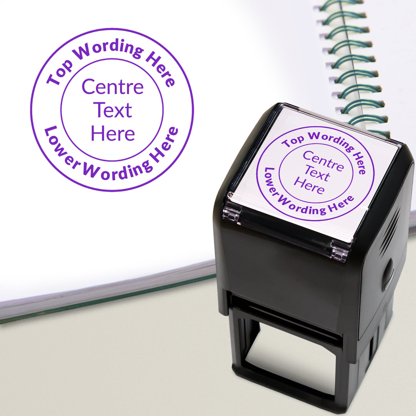 A 40mm round pre-inked stamper with purple ink, featuring a centre circle within which the wording is 'Centre Text Here' and the outer circle curving above and below the text is space for further personalisation.