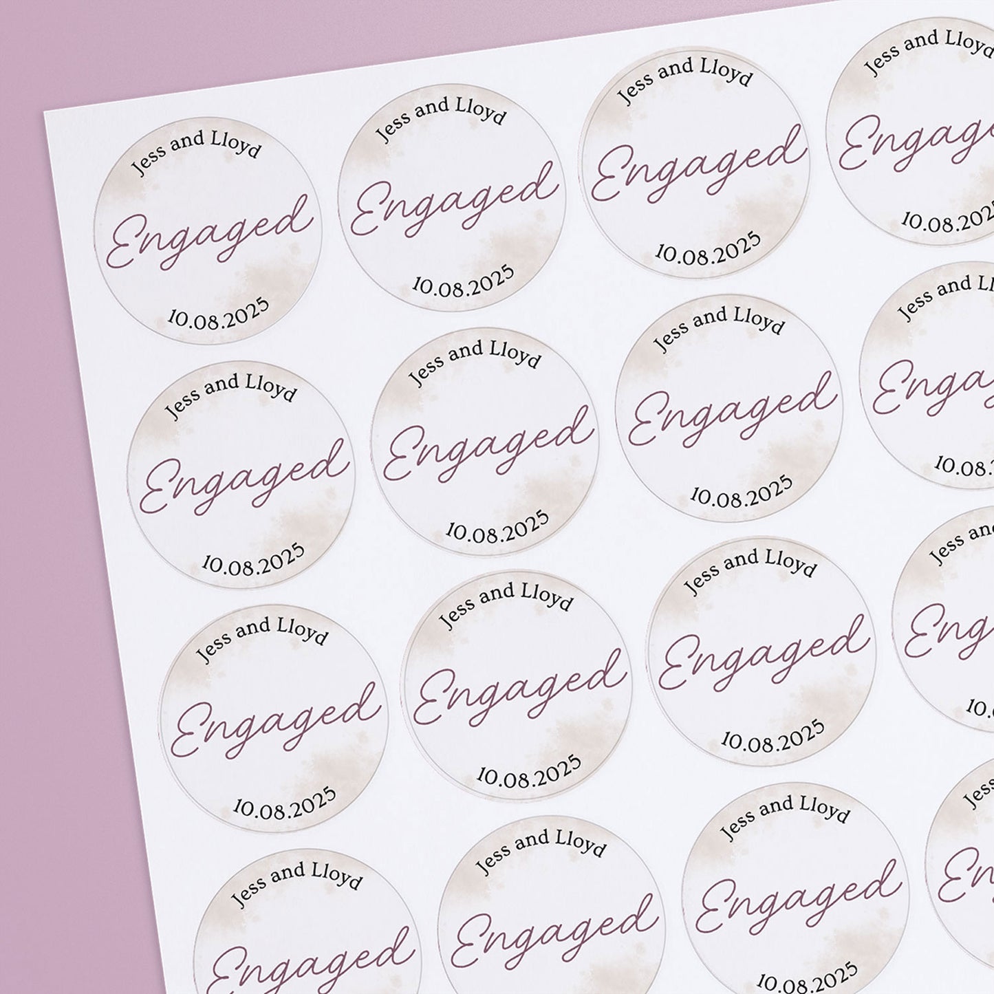 A sheet of personalised engagement stickers with central text 'Engaged' along with names and a date.