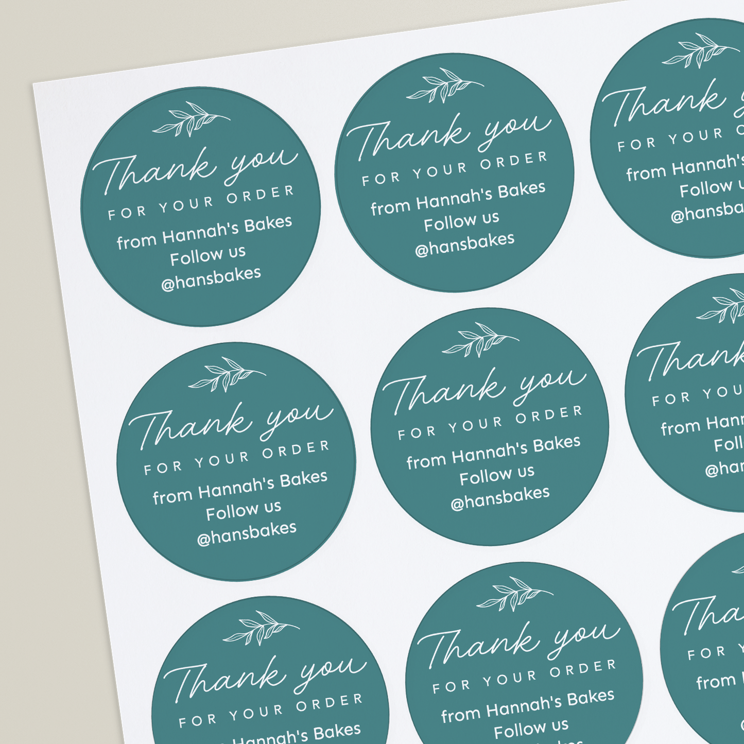 Teal sticker with the text Thank you for your order by Hannah's Bakes' and a social handle.