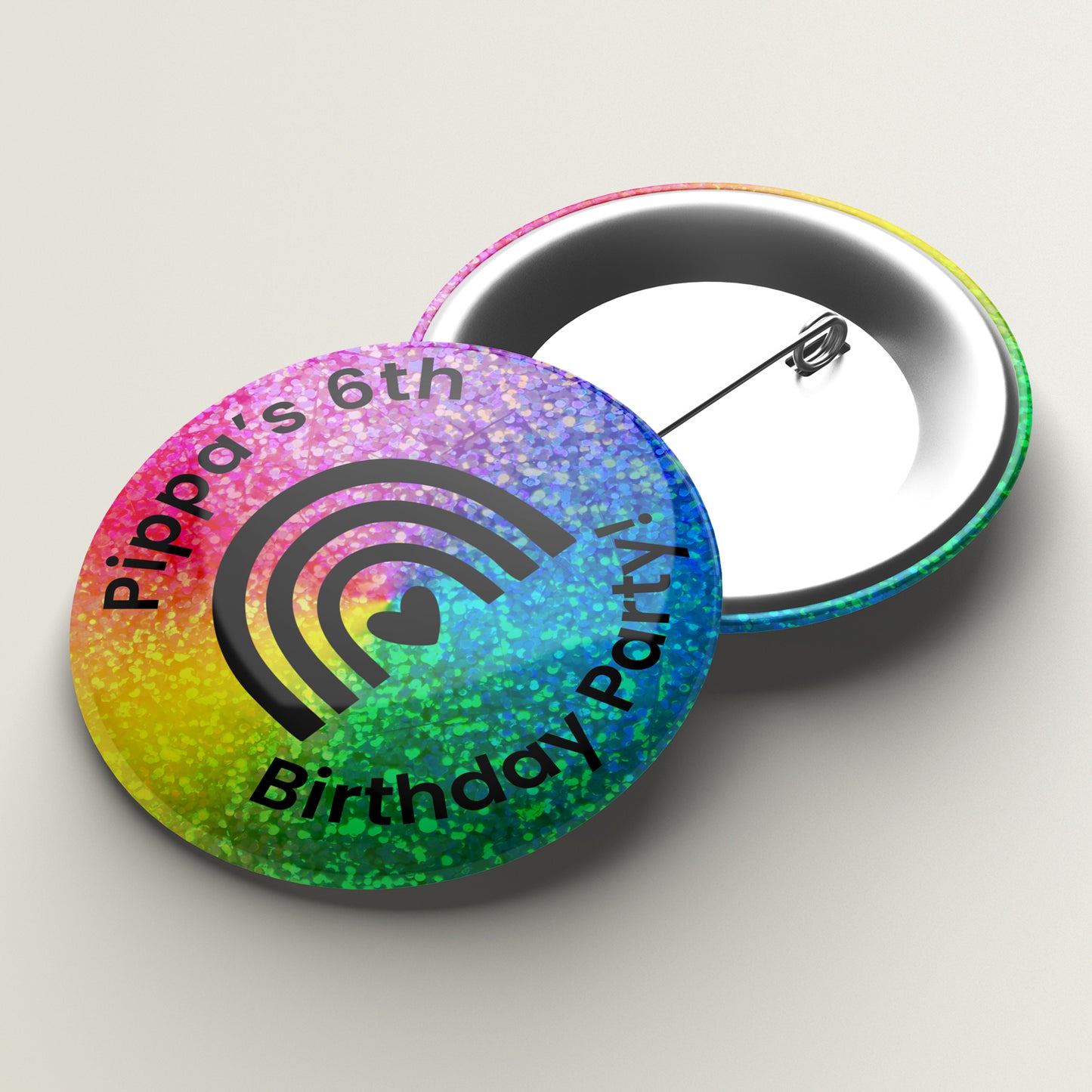 A holographic birthday badge with custom text and a colourful design.