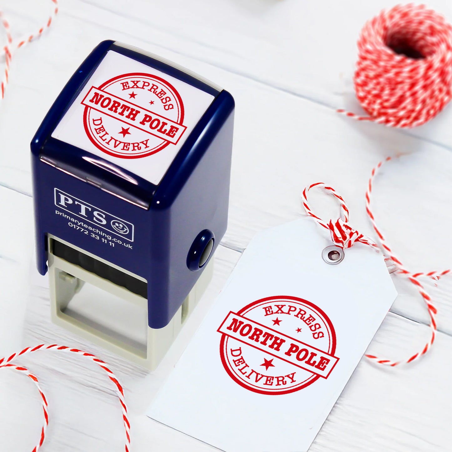 A self-inking rubber stamp with a circular red design reading 'EXPRESS DELIVERY' around the edge and 'NORTH POLE' in bold within a banner across the centre