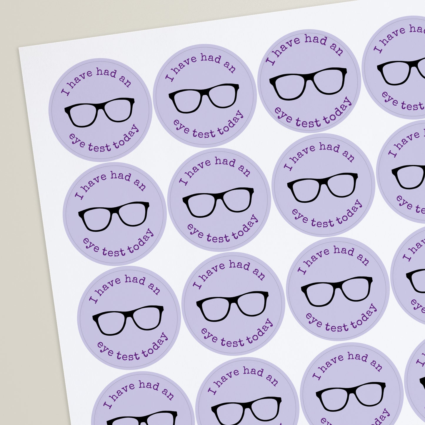 A sheet of purple stickers with a personalised message that reads 'I have an eye test today' and a graphic of eyewear.