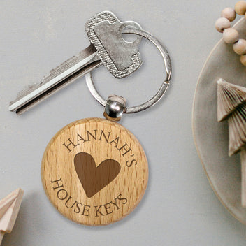 Personalised wooden keyring etched with an image and text.