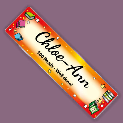 Personalised “Chloe-Ann” acrylic reading bookmark with “100 Reads – Well done!” message and colourful book and star illustrations.