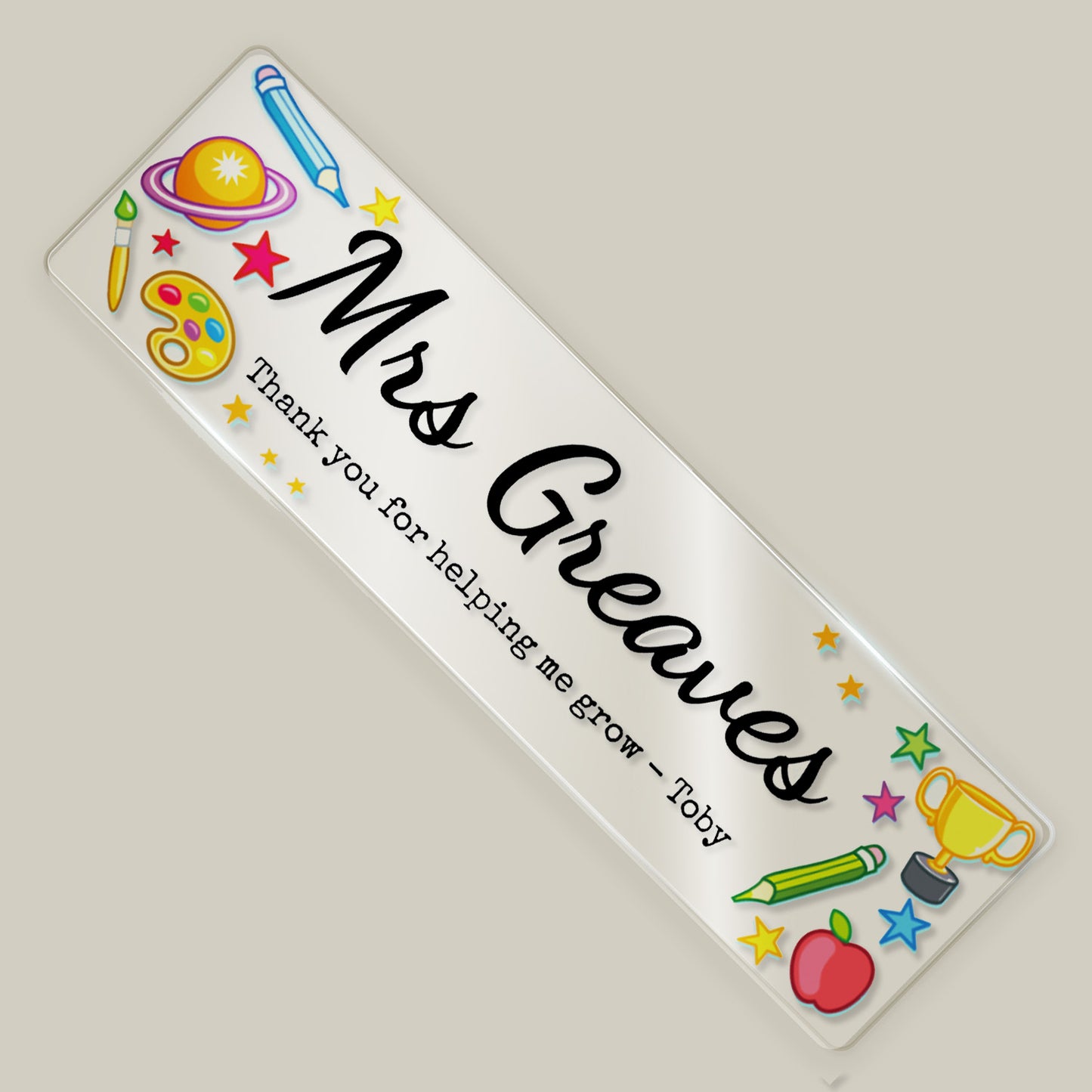 Personalised teacher acrylic bookmark with “Mrs Greaves” and thank you message, decorated with colourful school-themed illustrations.