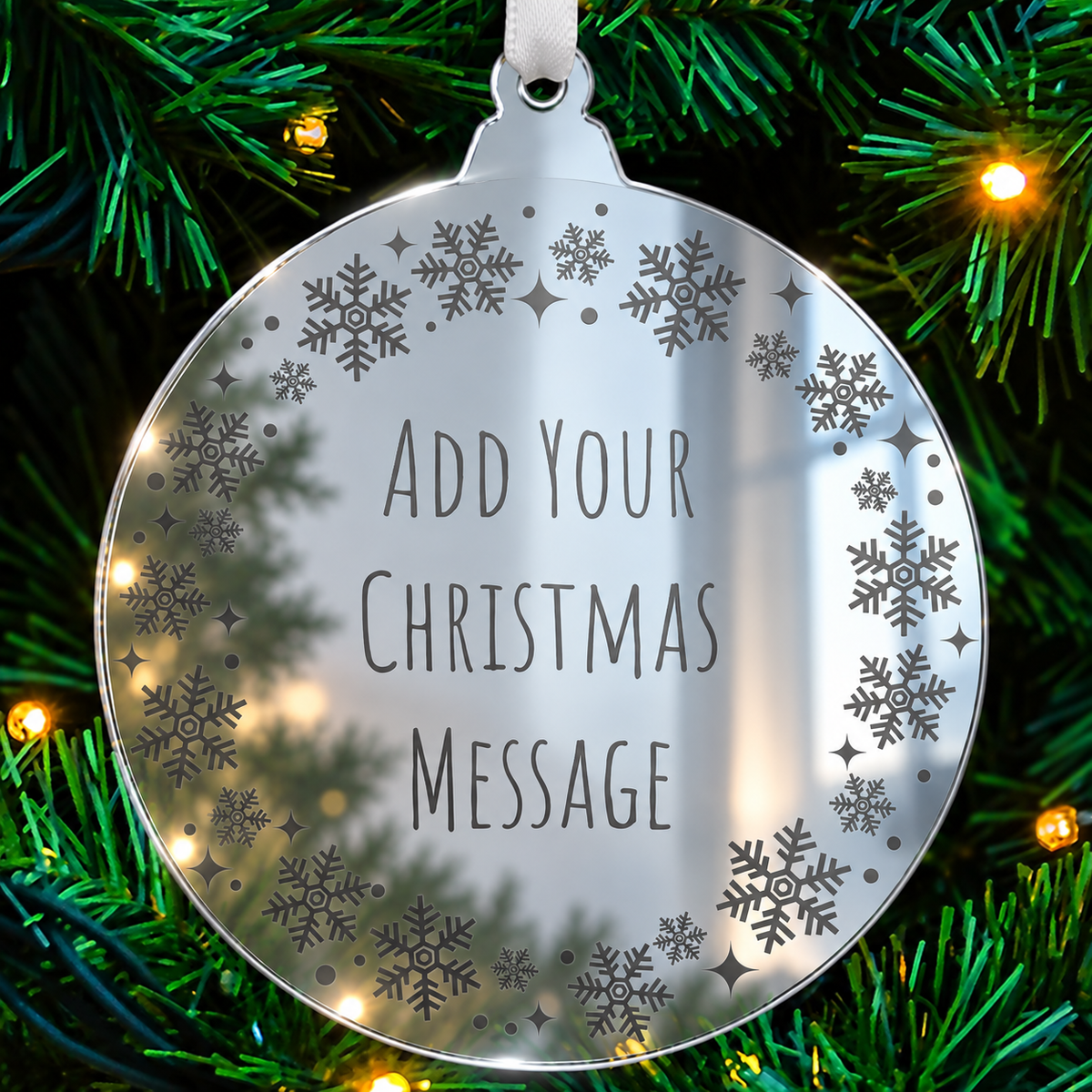 Personalised mirrored acrylic Christmas bauble with etched wording and festive border.