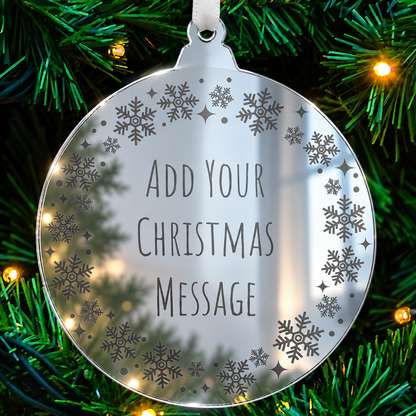 Personalised mirrored acrylic Christmas bauble with etched wording and festive border.