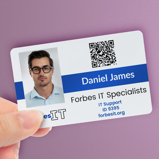 A personalised IT ID card with a photo, company division logo, main logo, and custom text. The ID card is held in a hand and has a blue colour strip - with the name 'Daniel James' and the title 'Forbes ID Specialist'.