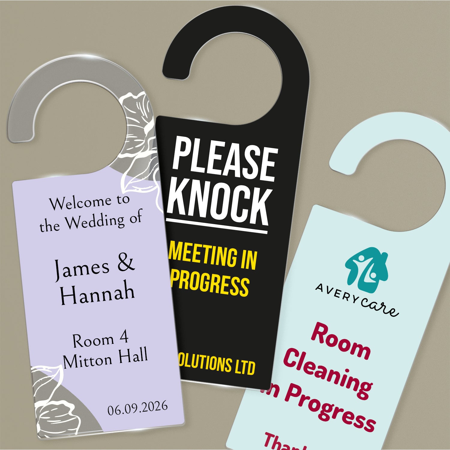 Three Acrylic Door Hangers left design ornate purple wedding design for 'James & Hannah', Middle design 'Please Knock Meeting In Progress on black background, right door hanger ' Room Cleaning in Progress' on a pale teal background