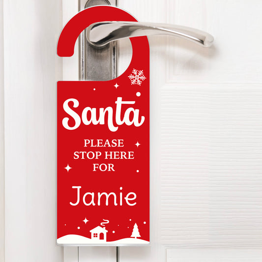 Red door hanger with 'Santa Please Stop Here For Jamie' text on a white background