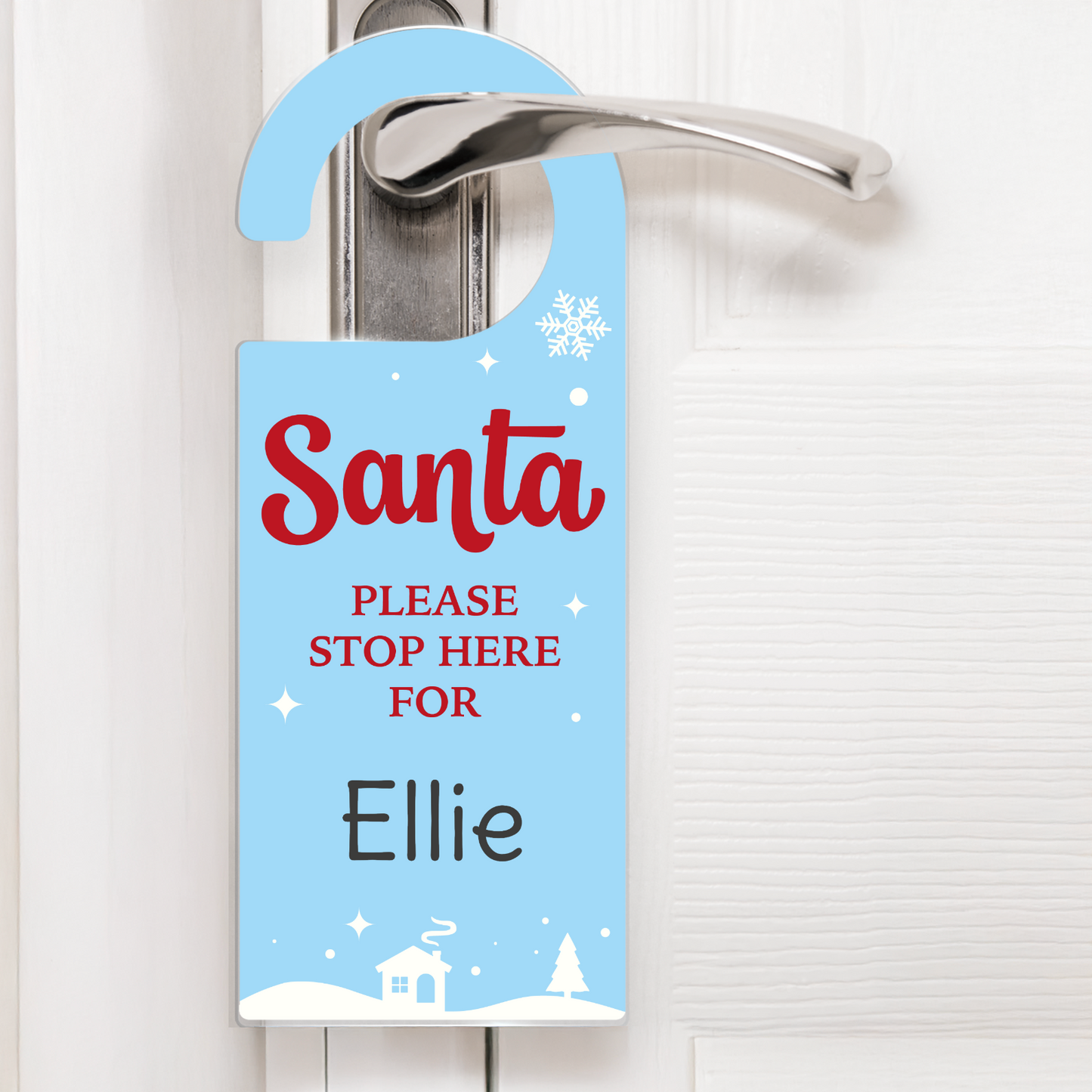 Door hanger with 'Santa Please Stop Here For Ellie' text on a blue background with snowflake and house illustrations.