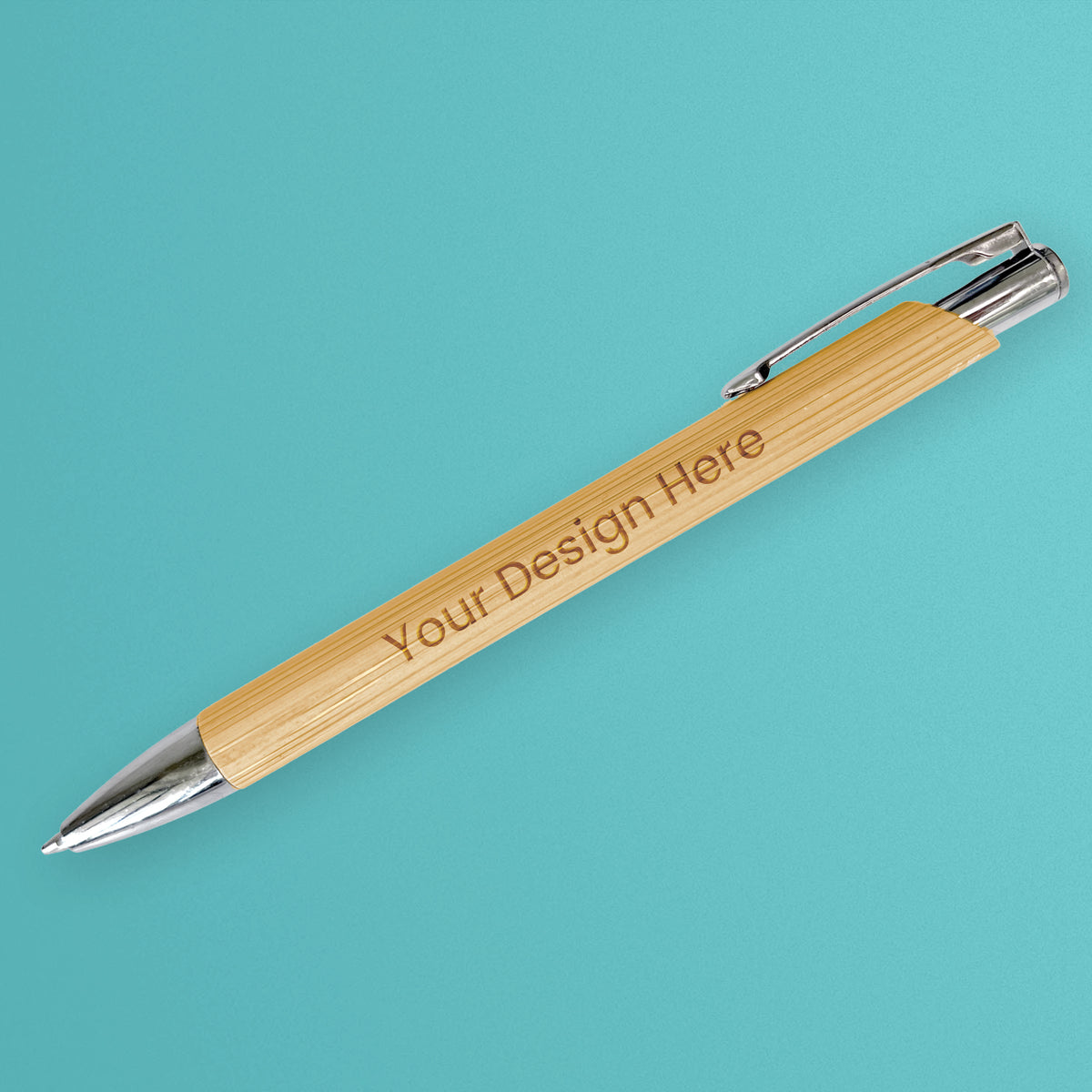 Personalised bamboo ballpoint pen with engraved wording, a retractable tip, pocket clip and polished silver-tone fittings.