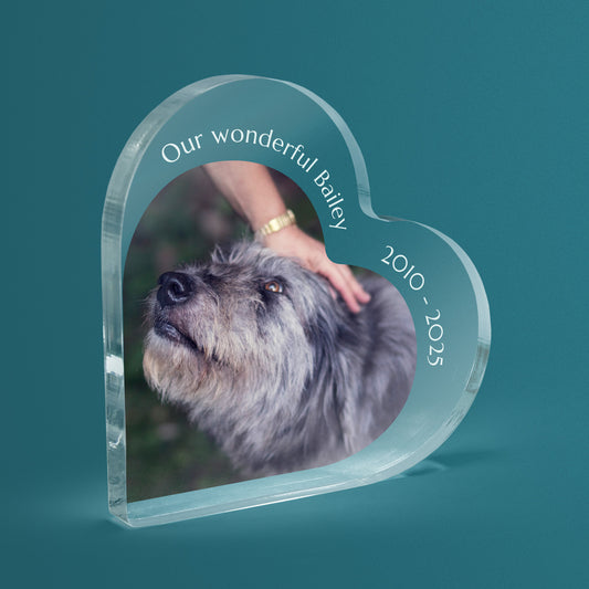 Heart-shaped acrylic block with a photo of a dog and personalised text on a teal background.