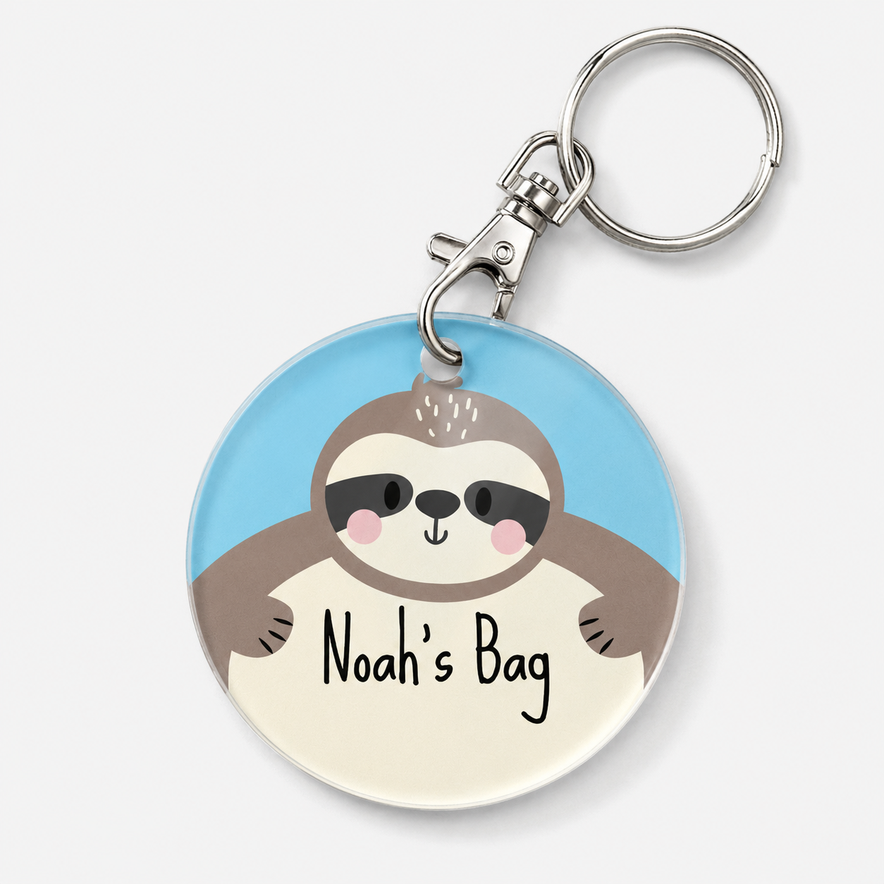 A custom acrylic keychain featuring a cartoon sloth on a light blue background with example text 'Noah's Bag' in black script.