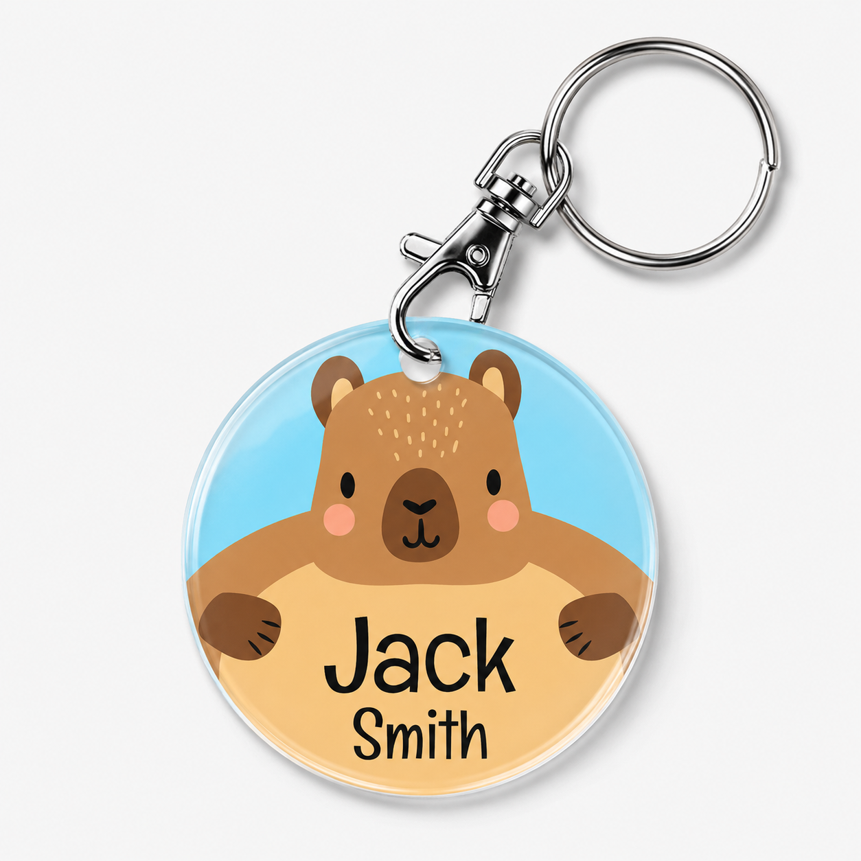 A personalised acrylic keychain featuring a cartoon capybara and example wording 'Jack Smith'.