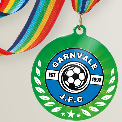 Acrylic personalised medal with rainbow ribbon showing green background with wreath design and 'Garnvale JFC' logo.