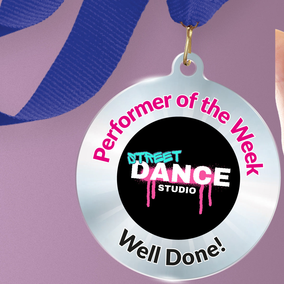 Acrylic personalised medal with blue ribbon showing silver design with 'Street Dance Studio image' and 'Performer of the Week', 'Well done!' wording.