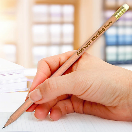 Hand holding a natural HB pencil, etched with 'Add your wording here' text.