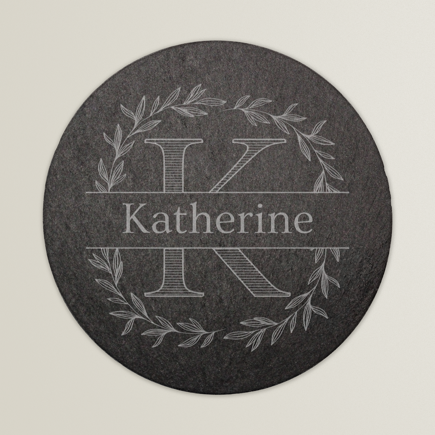 Round slate coaster with white monogram and name 'Katherine'