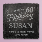 Slate coaster with engraved birthday message on a pink background