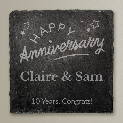 Slate coaster with 'Happy Anniversary Claire & Sam 10 Years. Congrats!' text on a gray background