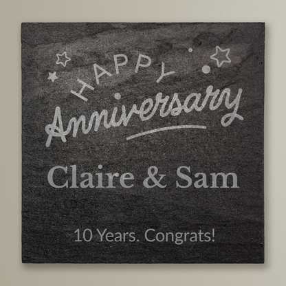 Slate tile with 'Happy Anniversary Claire & Sam 10 Years. Congrats!' text on a beige background