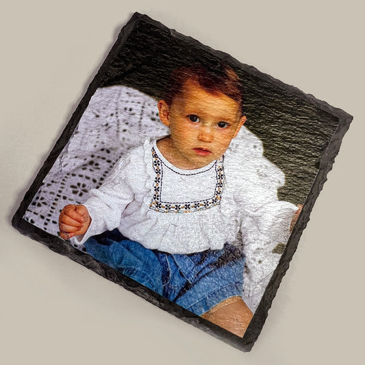 Child's photo printed on a slate coaster with natural finish
