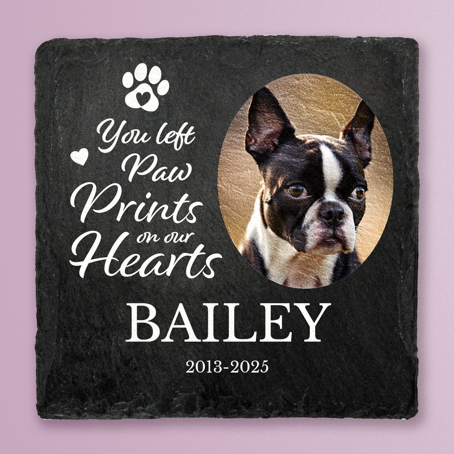 Slate coaster with printed photo of a dog with message You left paw prints on our hearts, Bailey, 2013-2025 in white text