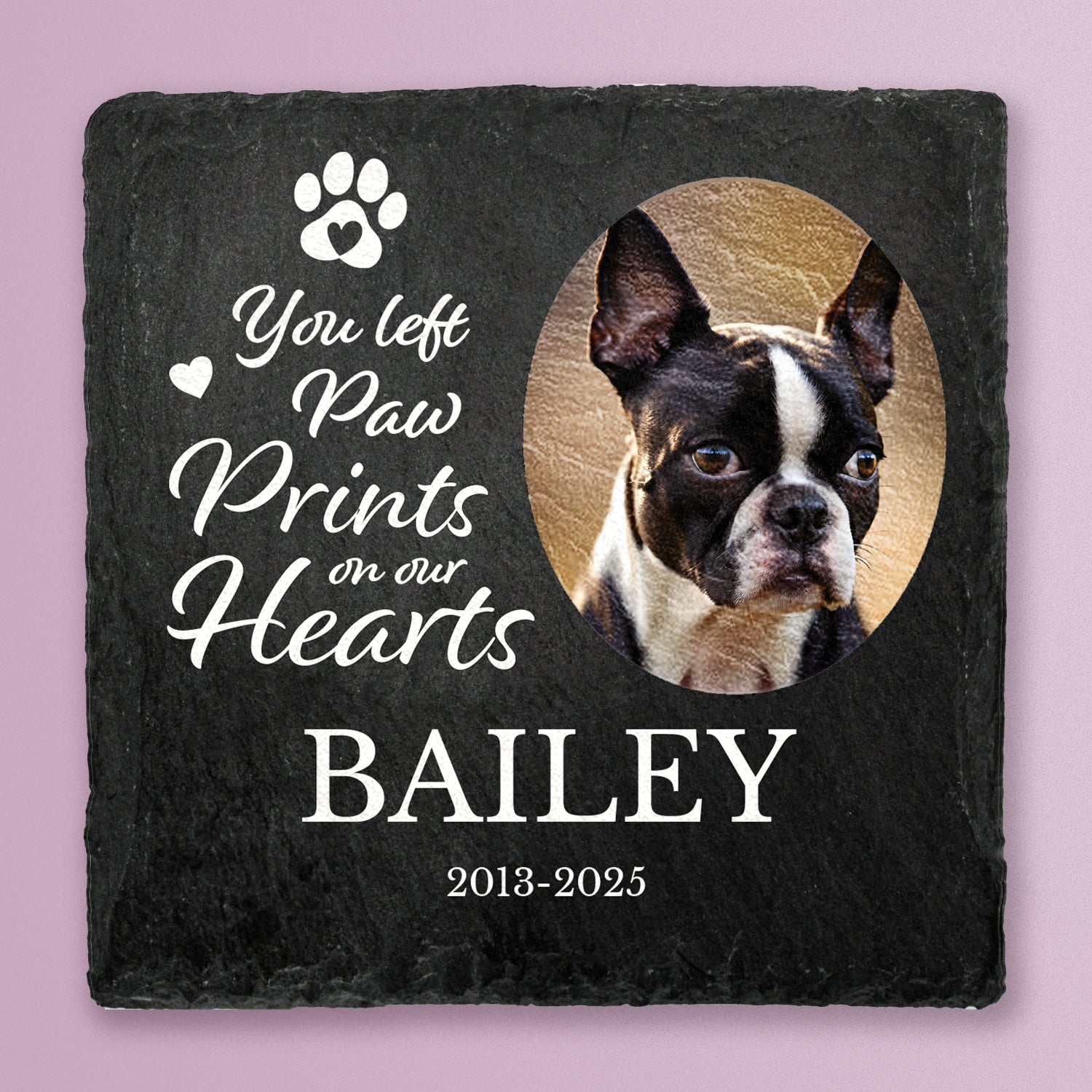Slate coaster with printed photo of a dog with message You left paw prints on our hearts, Bailey, 2013-2025 in white text