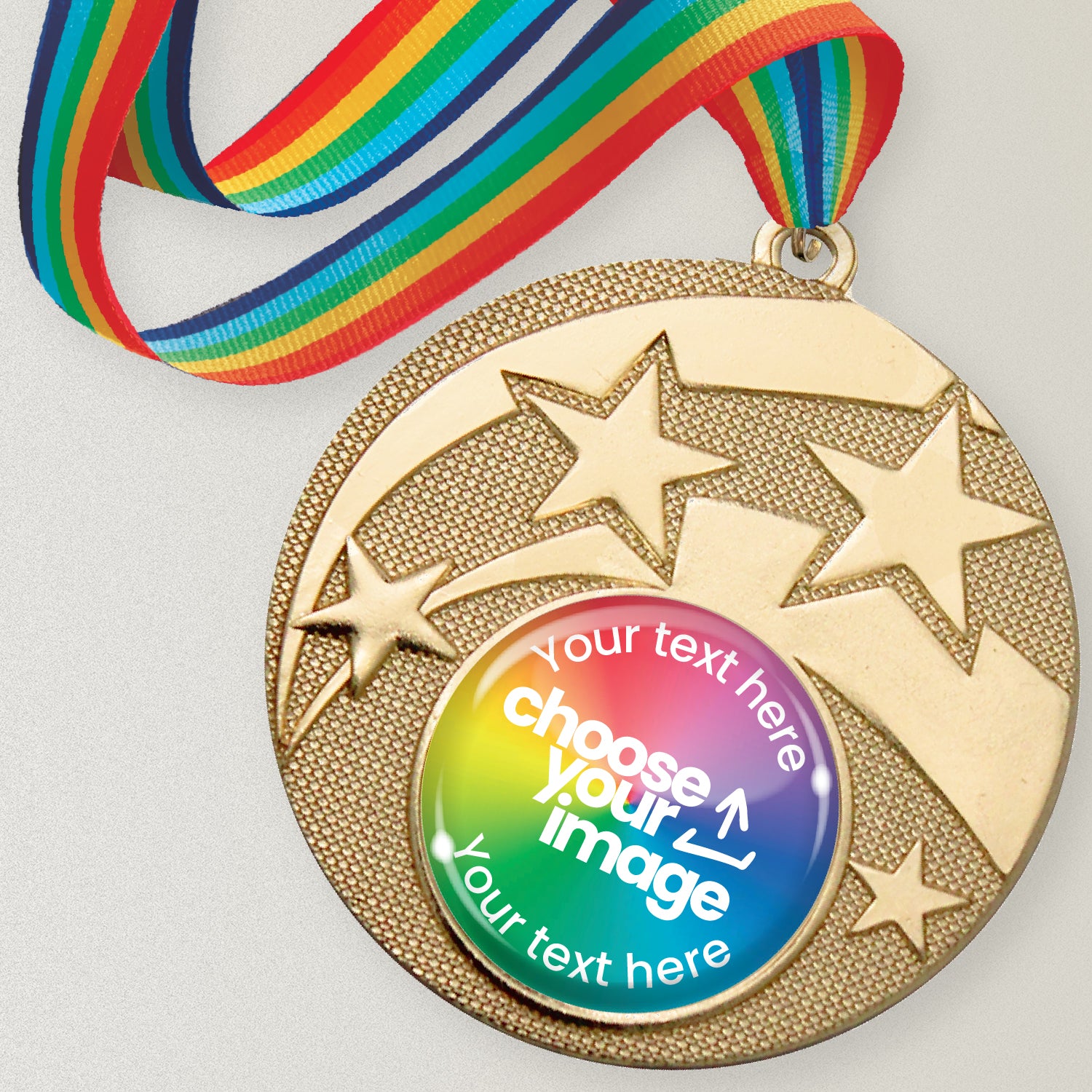 Gold medal with star design and customizable text and image area, attached to a rainbow ribbon.