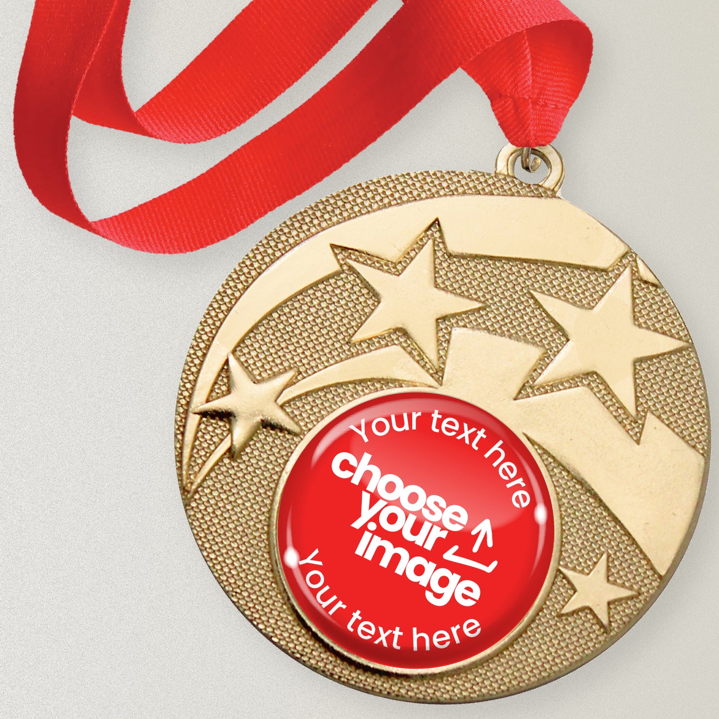 Gold medal with star design and customizable text and image area, attached to a red ribbon.