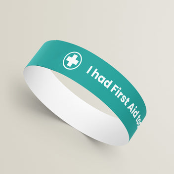 Colourful turquoise wristband with customised text advising 'I had first aid today'
