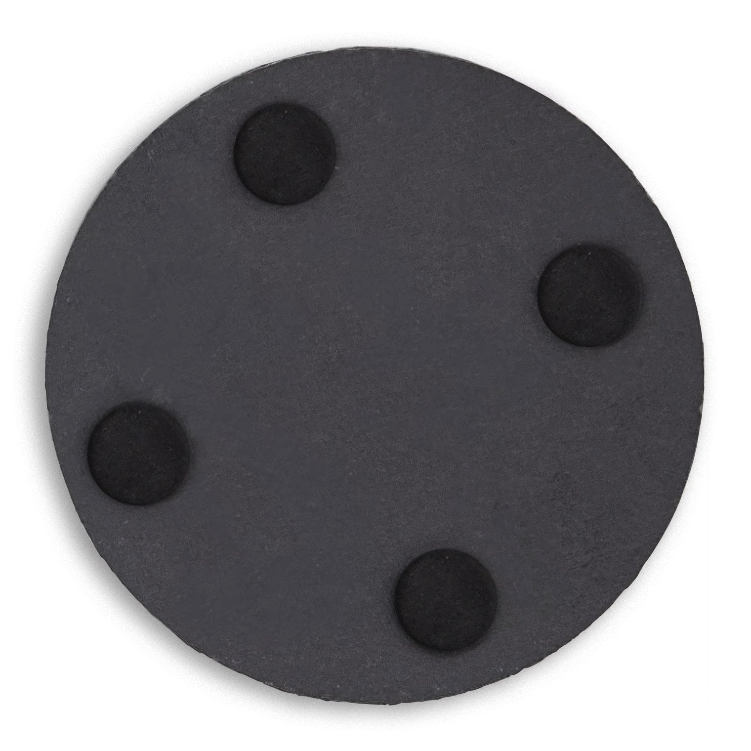 Under side of a circle slate coaster showing four foam feet.