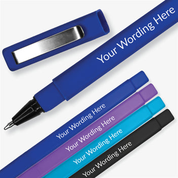 A set of four personalized pens with custom wording on each, featuring a blue ink cartridge and a brushed metal clip.