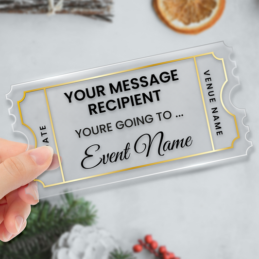 Clear acrylic gift ticket with customisable text held by a hand on a light background.