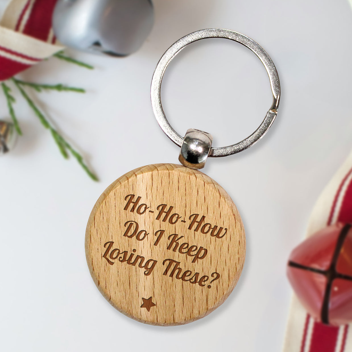 Personalised wooden keyring with humorous text.