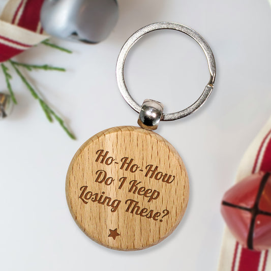 Personalised wooden keyring with humorous text.